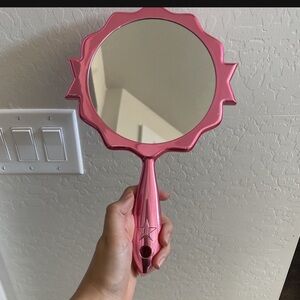 Pink Jeffrey star hand mirror